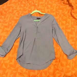 The limited blue/gray sheer blouse